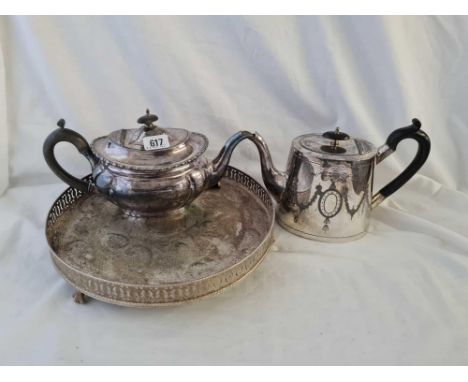 An oval teapot another and a tray 