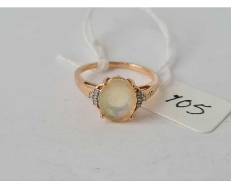 An opal single stone ring with diamond shoulders in 9ct size N ½ 2.2g inc