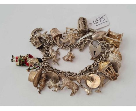 A silver charm bracelet - 92 gms 