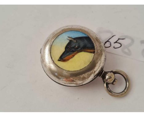 An antique plated enamel sovereign case depicting a Doberman Pincer dog