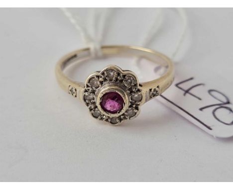 A ruby and diamond cluster ring 9ct size Q