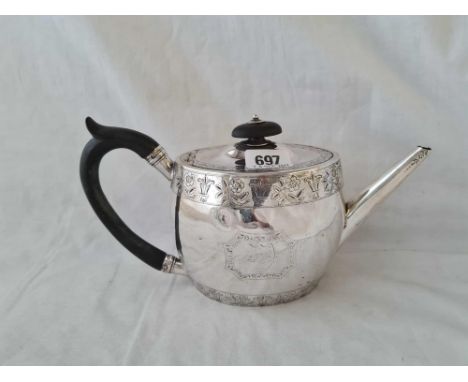 A Victorian oval teapot with bright cut decoration - Exeter 1870 by TS - 421 g.