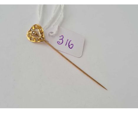 A gold and seed pearl heart shaped stick pin (one pearl missing) 10ct gold 