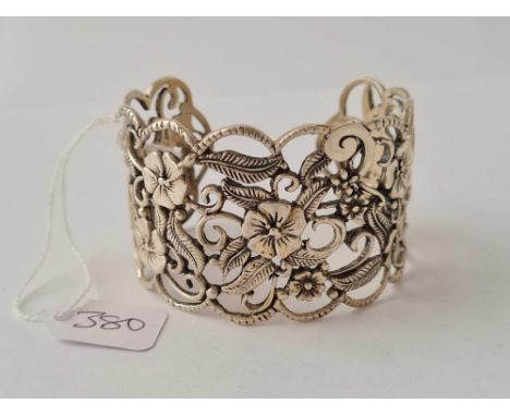 A ornate silver floral bangle - 48.2 gms 