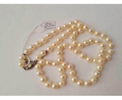 A Vintage cultured large pearl necklace with silver and pearl clasp 68cms long 