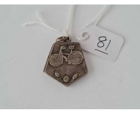 An unusual vintage silver locket with bicycle motif 