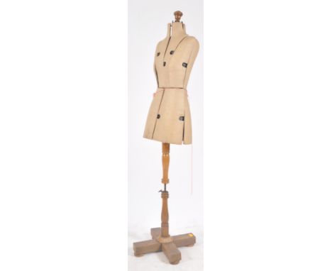 An Art Deco early 20th century dressmaker dummy mannequin. Oak turned skeleton structure with articulated adjustable padded m