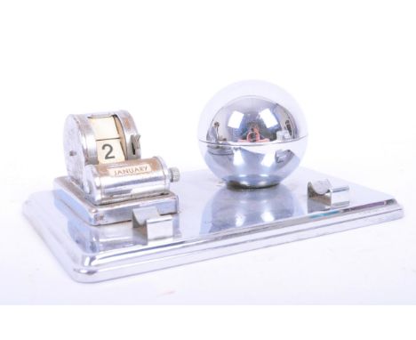 An Art Deco early 20th century circa 1930s chrome globe inkwell &amp; perpetual calendar on rectangular chrome base. Front pe