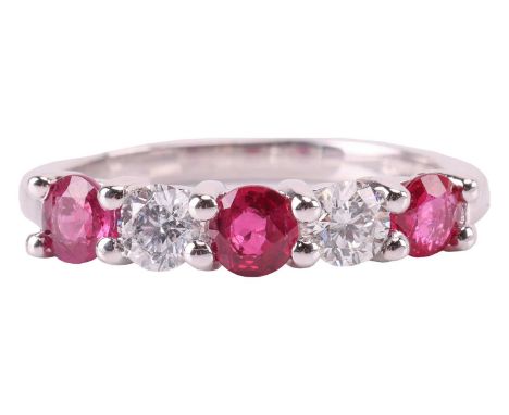 A ruby and diamond five-stone ring, featuring two round brilliant diamonds set between three round-cut rubies, with an estima