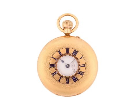 An 18ct gold half-hunter pocket watch, the engine turned cover with applied blue enamelled Roman numerals to a central glazed