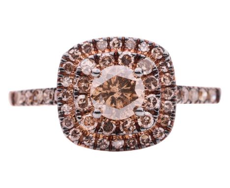 A brown diamond cluster ring in 9ct rose gold, centred with a round brilliant-cut diamond in claw setting, in a tiered surrou