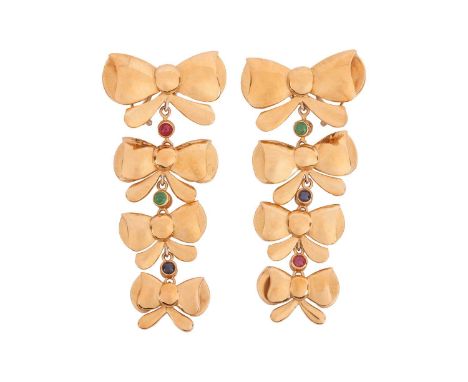 A pair of bow drop earrings, each comprising four graduated and stylised bows, tiered with links in between set with emerald,