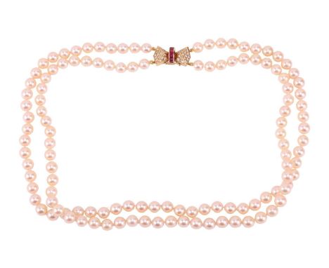 A double-row cultured pearl necklace with a ruby and diamond clasp in 18ct gold, comprising two strands of round cultured pea