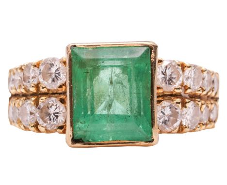An emerald and diamond dress ring, featuring a step-cut emerald in collet, approximately measuring 8.2 x 7.0 x 6.0 mm, flanke