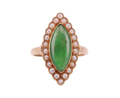 An Edwardian jade and seed pearl cluster ring in 18ct gold, collet-set with a navette-shaped jadeite cabochon of 13.8 x 6.5 x