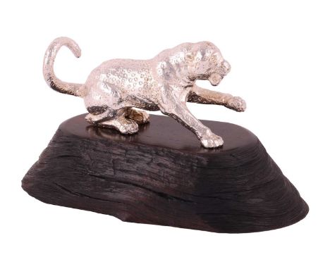 A Patrick Mavros figure of a leopard on an African blackwood base, overall 15.5cm wide, 9cm high, boxed with Patrick Mavros "