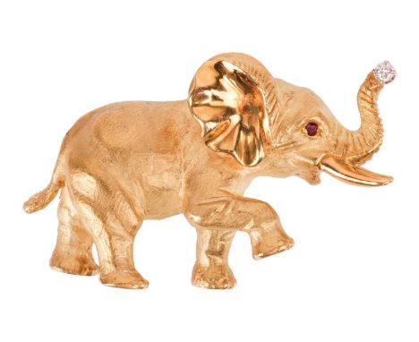 An elephant brooch by George Lederman, realistically sculpted as a circus elephant doing tricks, trunk highlighted with a bri