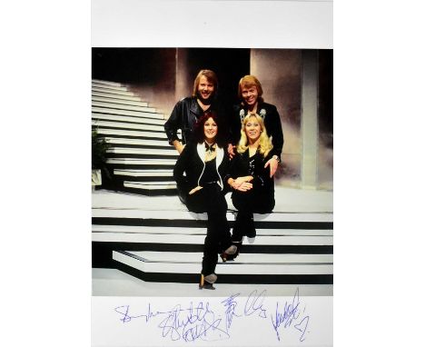 ABBA; a promotional colour photograph bearing the signatures of the band, 30 x 21cm.Condition Report: We have not authenticat