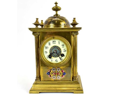 A late 19th/early 20th century French gilt brass enamelled mantel clock, the white enamelled dial set with Arabic numerals, w