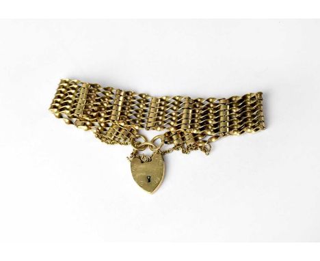 A 9ct gold seven bar gate bracelet with 9ct gold heart-shaped padlock clasp, length approx. 17cm, approx. 19g.