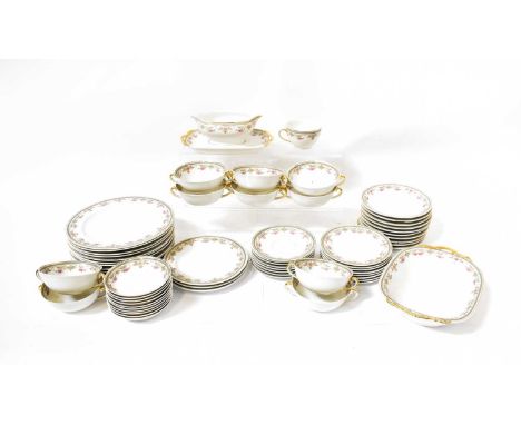 LIMOGES; part tea and dinner service with printed floral sprigs and slate blue and gilt border, comprising cups, saucers, sou