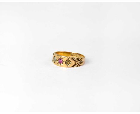 A 15ct yellow gold ladies' dress ring set with small ruby and single seed pearl (lacking one pearl), size M, stamped '15 .625