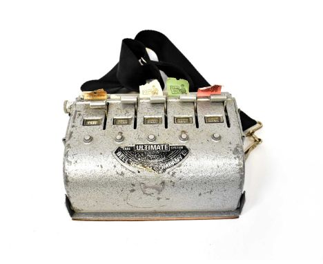 An early 20th century 'Bell's Co Ltd Ultimate Fare System' bus conductor's ticket machine with rolls of original tickets.