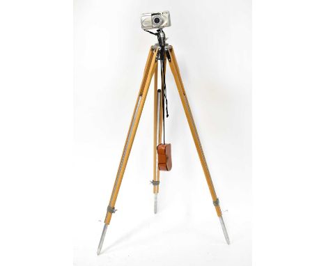 An Olympus Superzoom 100G camera on a wooden and metal tripod, with a Weston Master lightmeter (3).