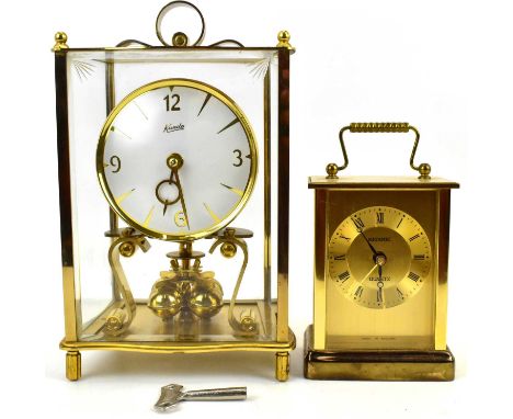 A Kundo brass and glazed cased anniversary clock and a modern Metamec quartz brass cased carriage clock (2).Condition Report: