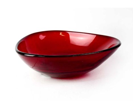 WHITEFRIARS; a teardrop-shaped three-sided ruby glass bowl designed by Geoffrey Baxter, 7.5 x 25cm.