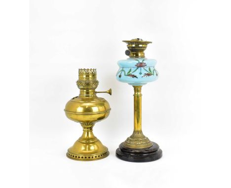 A Victorian paraffin lamp with painted blue glass font, raised on a brass column to a circular marble base, height to top of 