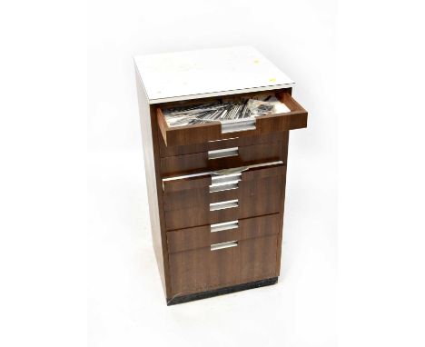 A modern nine-drawer cabinet, the drawers of various sizes, used in a dentist's practice, 90 x 46 x 43cm, with a quantity of 