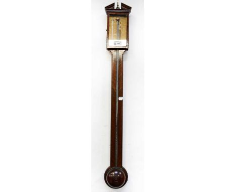 E. GRAY OF LONDON; a mahogany stick barometer, with broken swan neck pediment above brass dial, length 95cm.Condition Report: