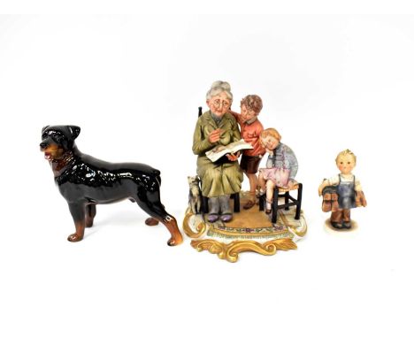 A Beswick model of a dog, a Hummel figure of a young boy shoe mender and a Capodimonte figure group of a grandmother reading 