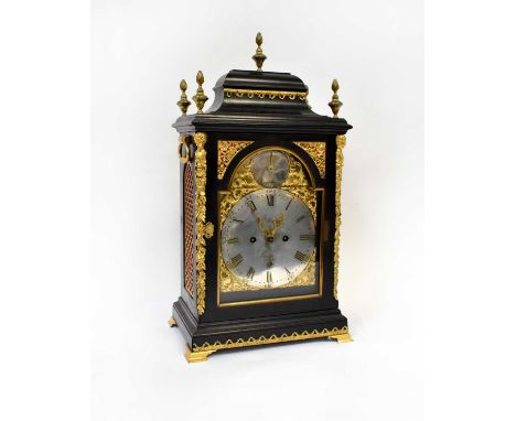 An ebonised gilt metal mounted eight-day mantel clock with pagoda case above arched dial set with silvered chapter ring, insc