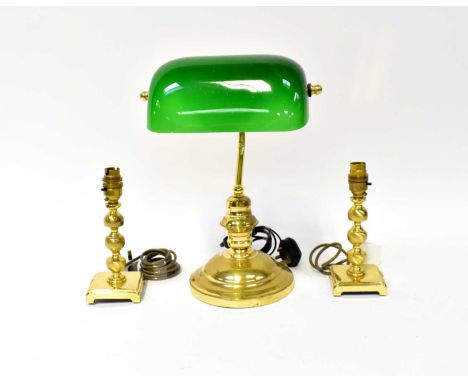 A brass and green glass shade desk lamp and a pair of brass table lamps, height 20cm (3).