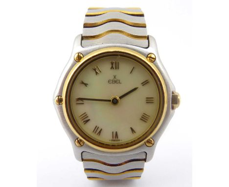EBEL; a ladies' two-tone stainless steel Wave wristwatch, the mother of pearl dial set with raised Roman numerals, five-screw