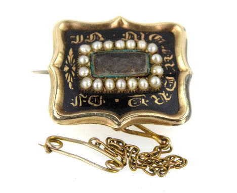 A mid-Victorian mourning brooch, with hair, black enamel and gilt writing, inscribed verso 'William Birdsall...' in gold-colo