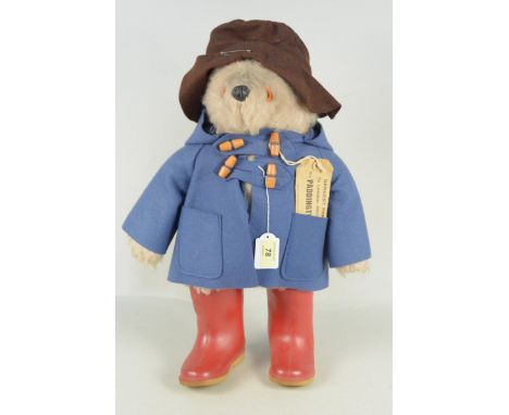 A 1970's Paddington Bear by Gabrielle Designs with Dunlop boots and original travel label, approx 50cm long (very mild play w