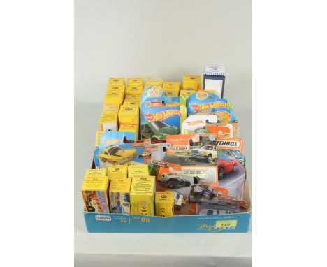 A large selection of boxed modern Dinky vehicles, vintage carded Mattel Hot Wheels and Matchbox