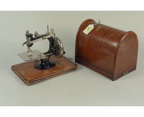 A vintage 'Lead' mini sewing machine in box
