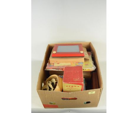A box of mixed vintage boxed games, an 'Argus' pre viewer, Etch A Sketch etc