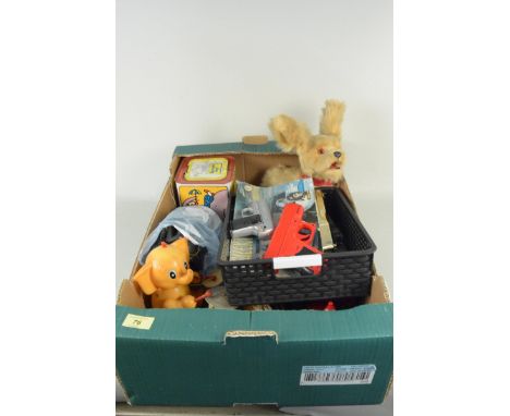 A box of mixed vintage childrens toys including cars, battery operated dog, guns etc