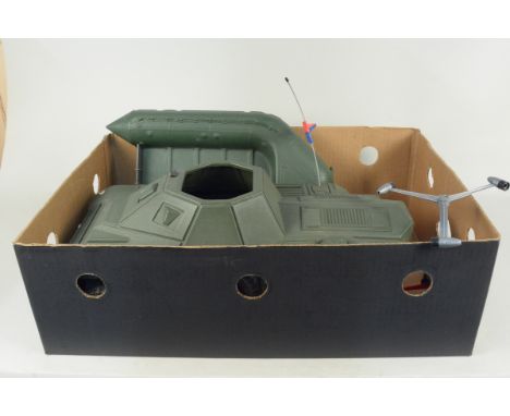 A vintage Action Man 'Irwin' armoured car, a dinghy with outboard motor and oars plus a MKIXA turbo-copter