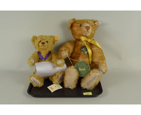 A Steiff for Harrods limited edition musical bear, signed to bottom of left foot J R Junginger, 42cm long plus a Steiff Golde