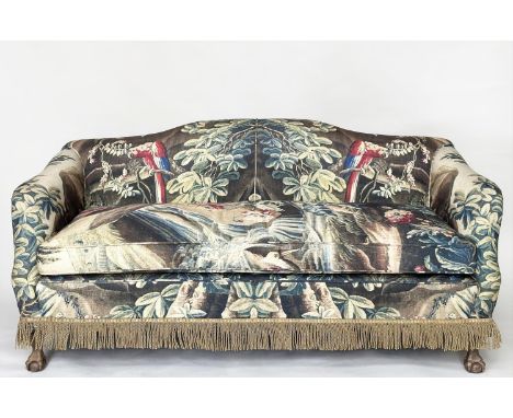 SOFA, early 20th century with camel back, French tapestry print upholstery and carved claw and ball feet, 178cm W. 