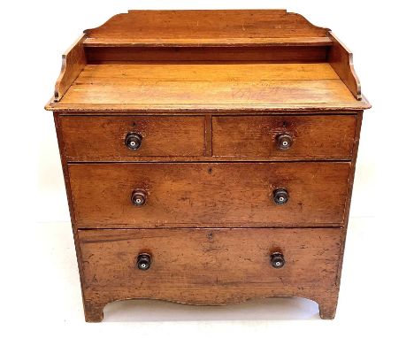 A Victorian stained pine chest. With a raised gallery above two short and two long drawers, height 115cm, width 106cm, depth 