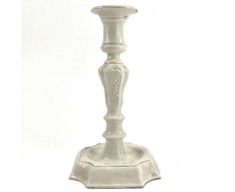 A pearlware moulded candlestick, circa 1810. In the early 18th century style, height 23.5cm.Under a UV light there is no evid
