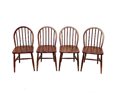 A set of four beech framed Utility dining chairs. With stick backs and solid seats, stamped marks (4).