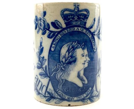 A George III pearlware blue and white mug. Printed with a double portrait of George III and Charlotte and inscribed King and 